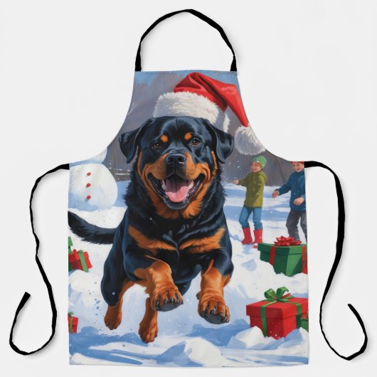 Rottweiler loopt in de sneeuw met kerst Pet Schort (Voorkant)