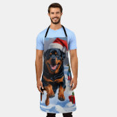 Rottweiler loopt in de sneeuw met kerst Pet Schort (Gedragen)