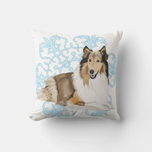 Rough Collie op een blauwe sneeuwvlok achtergrond Kussen