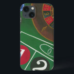 Roulette-tabel met chips en wiel iPhone 13 hoesje<br><div class="desc">Het draaiende wiel houdt al macht op de rouletlijst, maar de macht van dit schilderij is in de levensechte afbeelding van een casino scène. De groene van het vilt en de kleur van de chips zetten je aan tafel, wachtend op je weddenschap om af te betalen. Koop vandaag nog uw...</div>