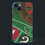 Roulette-tabel met chips en wiel iPhone 13 hoesje<br><div class="desc">Het draaiende wiel houdt al macht op de rouletlijst, maar de macht van dit schilderij is in de levensechte afbeelding van een casino scène. De groene van het vilt en de kleur van de chips zetten je aan tafel, wachtend op je weddenschap om af te betalen. Koop vandaag nog uw...</div>