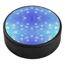 Round blue Bluetooth speaker with a front design
