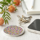 Round keychain featuring intricate floral patterns (Zijkant)