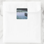 Rowboat on small lake surrounded by water vierkante sticker (Tas)