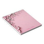 Roze bloemen decoratie met roze achtergrond notitieblok (Schuin)