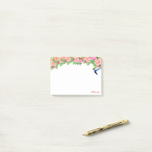 Roze bloemen, kolibrie en kalligrafie op wit post-it® notes (Op bureau)