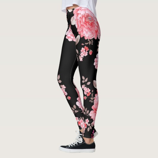 Roze bloemen met zwarte achtergrond. leggings (Links)