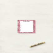 Roze bloemen op een rode Post-it Post-it® Notes (Op bureau)