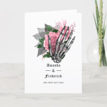 Roze bloemenskelet gotisch trouwprogramma