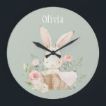 Roze Blush Bunny Sage Green Name Nursery Clock Grote Klok<br><div class="desc">Kute en zoete roze waterverf konijnenkonijn met bloemaccenten in een mandje. Zachte groene achtergrond. Voeg je naam toe. Schattig. Elke dag 100% klanttevredenheid met Zazzle.</div>