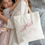 Roze Bow-Canvas tas<br><div class="desc">Voeg een vleugje elegantie en vrouwelijkheid toe aan uw dagelijkse stijl met deze chique canvas tas met een delicate roze strik en een gepersonaliseerd script initiaal monogram. Het zachte, girly ontwerp is perfect voor een stijlvol accessoire, het toevoegen van een schattig en trendy accent aan elke outfit. Eenvoudig aan te...</div>