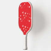 Roze drijvende harten op rood pickleball paddle (Links)