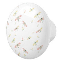 Roze en gele libellen op witte keramische knop