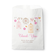 Roze en oranje bloemstukken bruidsfeest vogelkooie