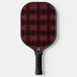 Roze en rode stippen en kronkelende patronen op zw pickleball paddle