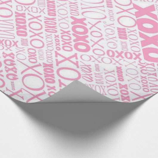 Roze en witte handschokken en draaiend papier (Hoek)