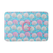 Roze en witte zeeschelpen op turquoise badmat (Voorkant)