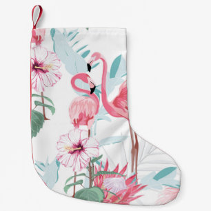 Roze flamingo en exotische bloemen, palmbladeren, kleine kerstsok
