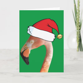 Roze flamingo in een rode cartoon kerstman hoed feestdagen kaart