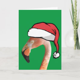 Roze flamingo in rode cartoon kerstman hoed feestdagen kaart