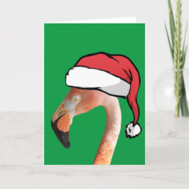 Roze flamingo in rode cartoon kerstman hoed feestdagen kaart