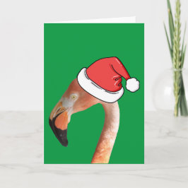 Roze flamingo in rode cartoon kerstman hoed feestdagen kaart