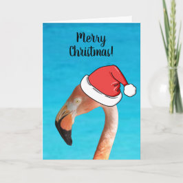 Roze flamingo met rode cartoon kerstman hoed feestdagen kaart