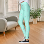 Roze flamingo's mintgroen leggings<br><div class="desc">Mint groene achtergrond versierd met een roze flamingo patroon.</div>