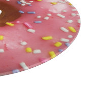 Roze geglazuurde donut met sproinkles snijplank (Hoek)