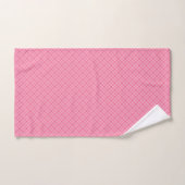 Roze geruite handdoeken set tentoongesteld aan een (Handdoek)