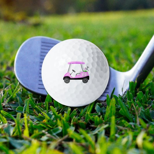 Roze golfkar met monogram golfballen