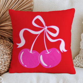 Roze kers op trendy fruitkunst in levendig rood kussen