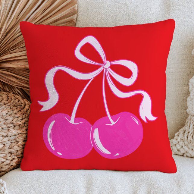 Roze kers op trendy fruitkunst in levendig rood kussen (Creator heeft geüpload)