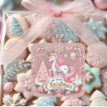 Roze Kerst Wonderland Eenhoorn Vierkante Sticker<br><div class="desc">Vier de magie van het vakantieseizoen met deze betoverende "Pink Christmas Wonderland" sticker. Met een grillige eenhoorn met een pastelroze manen, gouden accenten en een koninklijke kroon, is dit ontwerp omgeven door snoepstokken, een sprankelende kerstboom, ornamenten en sneeuwvlokken. Deze sticker is ideaal voor cadeauverpakkingen, vakantiefoto's, feestartikelen of decoraties en combineert...</div>