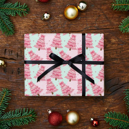 Roze kerstbomen versierd met strikken. cadeaupapier