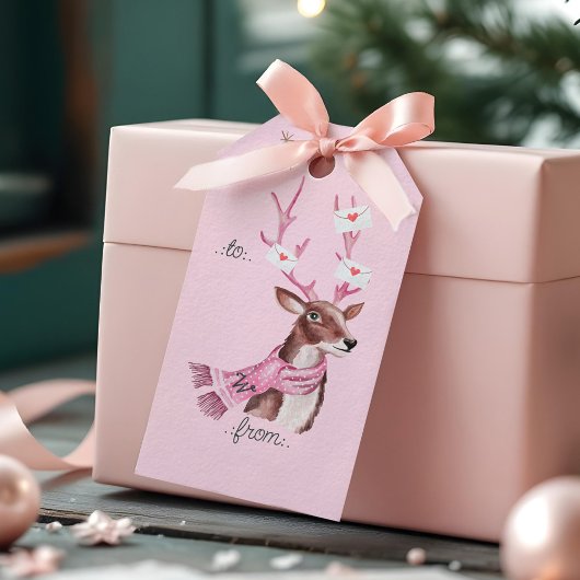 Roze kerstretro rendier naar van cadeaulabel