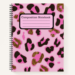 Roze laptop met opening voor samenstelling notitieboek