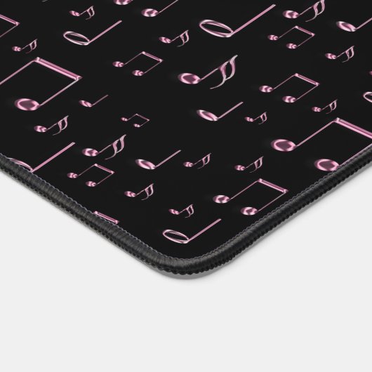 Roze muzieknoten op zwarte achtergrond bureaumat (Hoek)