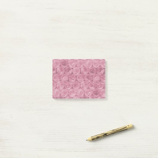 Roze omwikkelpatroon post-it® notes (Op bureau)