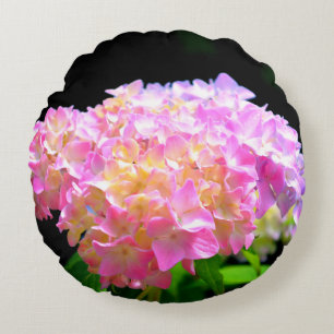 Roze paarse oranje hydrangeas rond kussen