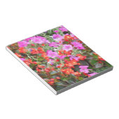 Roze petunia en rode geraniums notitieblok (Schuin)