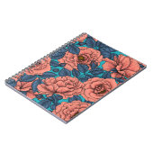 Roze rozen met blauwe bladeren op blauw notitieboek (Linkerzijde)