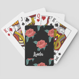 Roze rozen op zwart pokerkaarten