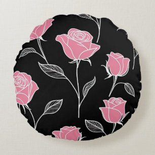 Roze rozen op zwart rond kussen