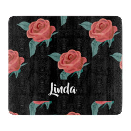 Roze rozen op zwart snijplank