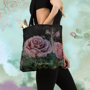 Roze rozen op zwart tote bag