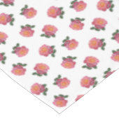 Roze rozenbloemen op wit tafelkleed (Gekanteld)