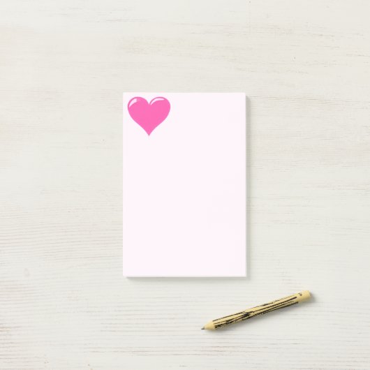 Roze stekende noot bij het hart post-it® notes (Op bureau)