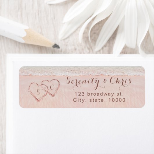 Roze strandharten in het zand retouradres etiket (Insitu)