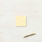 Roze striklijst met gele opsommingstekens en strik post-it® notes (Op bureau)